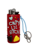 A red novelty lighter featuring the text 'CNTY LIL BTCH' in white, decorated with 3D heart shapes in yellow, brown, and light blue, along with small colorful rhinestones. It has a light blue wrist strap and a silver metal keychain clasp on a plain white background.

CLB sassy handmade polymer clay BIC lighter case with keychain