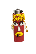 A lighter shaped like a stylized face with a red body, yellow hair, white eyes, and a gold chain attached to the side. 
Honey Blaze yellow and red handmade polymer clay lighter case with keychain.