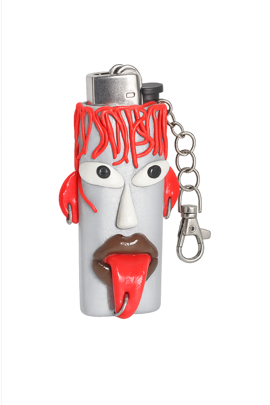 A lighter shaped like a stylized face with red hair, a white face, brown lips, and a red tongue, featuring a silver metal keychain attachment. Hot Mess Express handmade character polymer clay lighter case with keychain