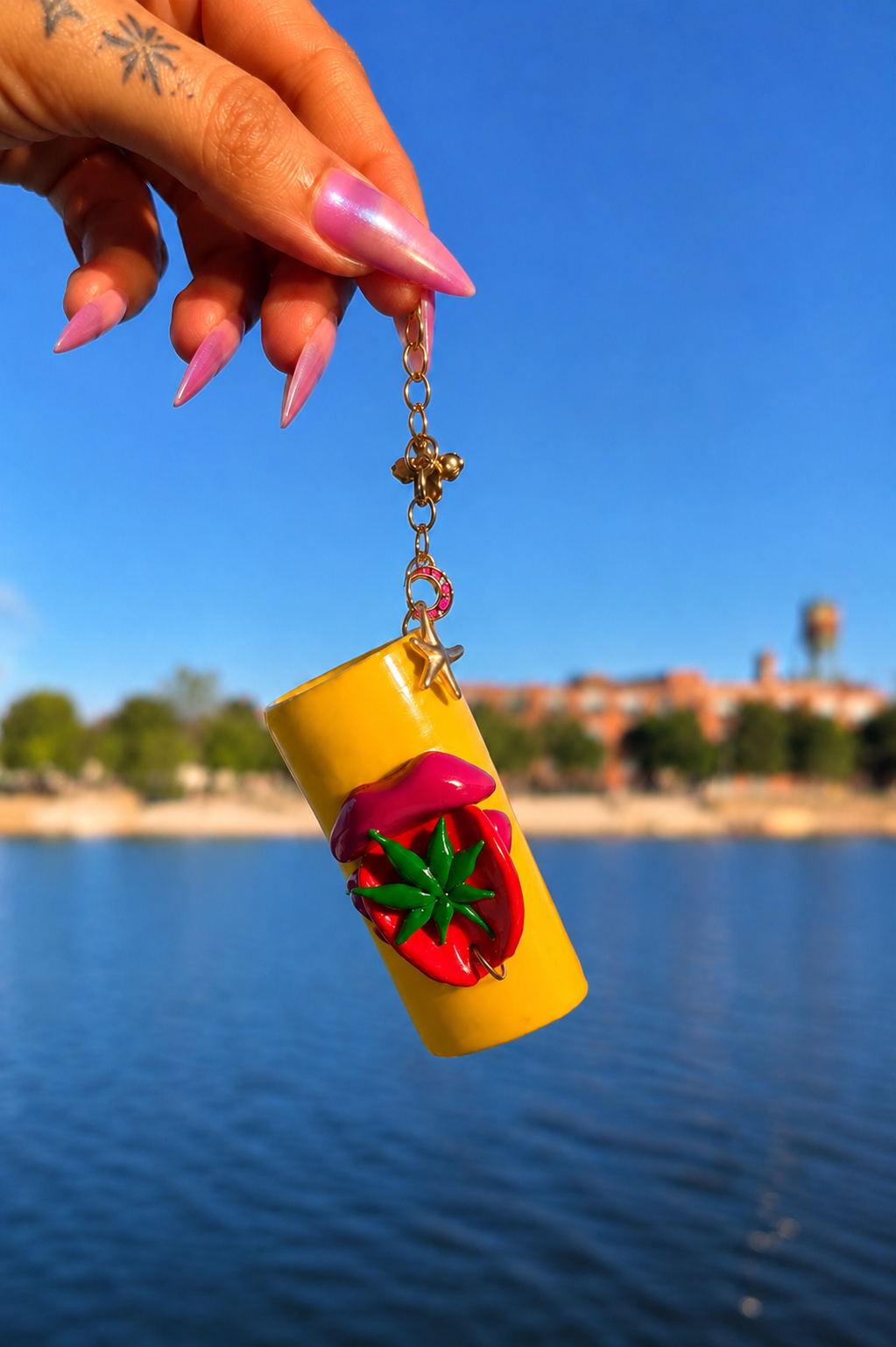 Touch Grass yellow handmade polymer clay lighter case with green and red details