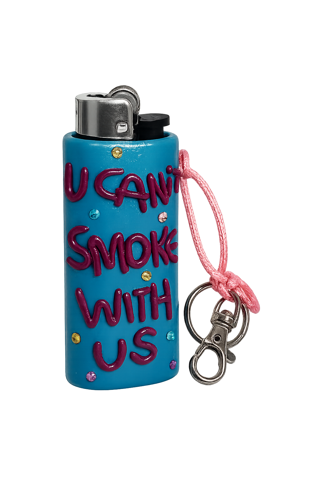 A turquoise blue novelty lighter with the text 'I CAN'T SMOKE WITH US' in dark pink bubble letters, decorated with small rhinestones, featuring a pink cord and silver metal keychain clasp on a white background.
U Can’t Smoke With Us handmade colourful lighter case with keychain